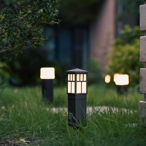 Low Voltage Outdoor Path Lights 8 Pack LED Landscape Lights 12V Warm White 3200K illuminating garden walkway at dusk
