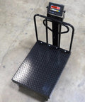 Heavy Duty Digital Platform Bench Scale With Smooth Roll Casters And Reinforced Backrail, 24 By 32 Inches view from above, rugged surface, weighing display.