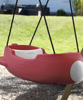 Red rocket swing with weather resistant rope, outdoor baby swing for toddlers 9 months to 3 years, attached to playset in the backyard.