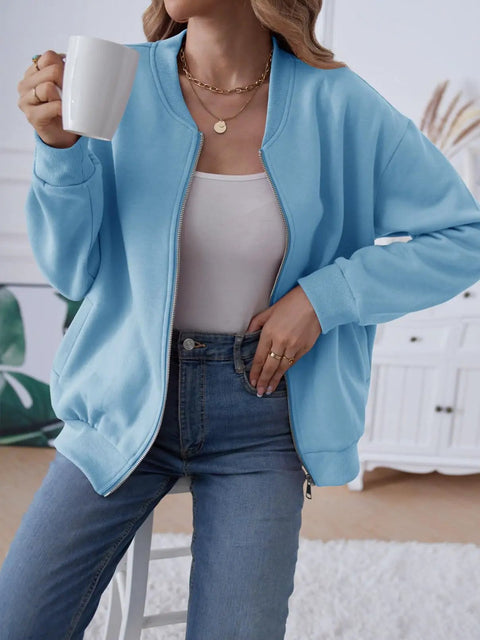 Woman wearing Trendy Long Sleeve Full Zip Sweatshirt Bomber Jackets For Teen Girls Blue Lightweight Soft And Stretchy Loose Fit Size Small