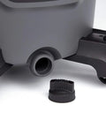 Close-up of the drainage port and wheels of 12 Gallon Wet Dry Shop Vacuum Workhorse With 5 Peak HP Motor, Dark Gray and Red