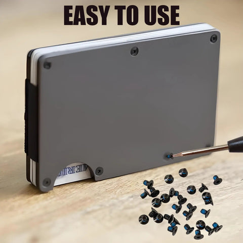 Top Shelf Thirty Piece Replacement Kit For Ridge And Minimalist Metal Wallets With Bonded Threadlocker T5 Torx And Hex Driver To Keep It Secure On The Daily Grind with screws and driver on wallet.