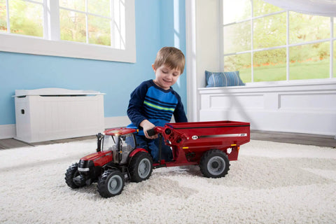 Child playing with Big Farm Tractor Toy For Kids With Realistic Lights And Sounds Opening Hood Removable Front Weights Three Point Hitch