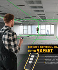 Man using Ultra Precise 4x360 Degrees Self Leveling Laser Level Kit With Tripod, LCD Touch Screen, Green Cross Line in an empty room