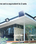 Solid Solar Flood Light With A Kickin Brightness Setup And Zero Sweat Weather Proofing For Your Patio Decks And Yard Upgrades Including Remote Controls And Hella Efficient Led Lighting For Real Deal Outdoor Nighttime Illumination on a modern house rooftop.