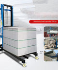 Top Shook Heavy Duty Rolling Construction Hoist Lifting Platform For Ducts Panels And Bricks With Smooth Casters That Makes Loading A Breeze Up To 13 Feet High On Any Job Site Today with heavy material load.