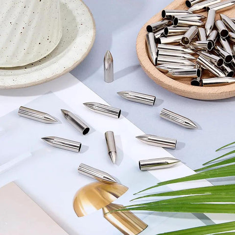 50 Pack Stainless Steel 7mm Arrow Tips Field Points Glue On For Arrows spread on table ready for assembly