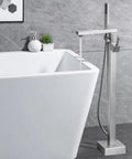 Freestanding Bathtub Faucet Floor Mounted Brass One Handle With Hand Shower Brushed Nickel Finish next to tub in modern decor