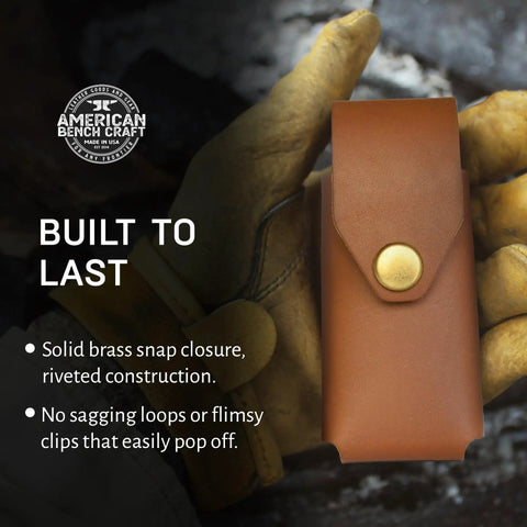 Tan Leather Multitool Holster For Suspension And Suspension NXT Belt Clip Pouch shown in hand, featuring solid brass snap closure.