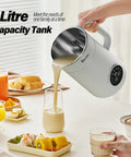 All In One Nut Milk Maker With 35 Oz Capacity, 10 Blades, One Touch Start, pouring milk into glass on countertop