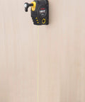 Magnetic Plumb Bob Setter 14 Ounce With Quick Stabilization Self Retracting 14.5 Foot Line on Wooden Surface