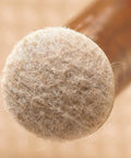 Close-up of Secure Grip Formed Felt Furniture Pads Linen 1 Inch Cup Design on furniture leg for floor protection
