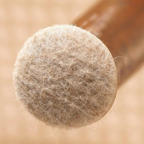 Close-up of Secure Grip Formed Felt Furniture Pads Linen 1 Inch Cup Design on furniture leg for floor protection