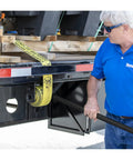 Person using 40 Inch Combo Winch Bar For Steel Trailer Winches, Black Powder Coated Carbon Steel, Heavy-Duty Leverage Tool For Tightening Straps And Forged Load Binders On Tough Jobs on trailer.