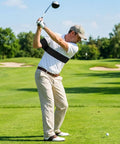 Golfer using Golf Swing Arm Band Training Aid For Correct Posture And Smooth Swing Plane Flexible Arm Corrector Tool on course