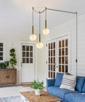 Mid Century Modern Large Gold Globe Pendant Light Plug In With Brushed Brass Finish And White Glass Minimalist Sphere in living room