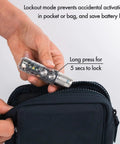 Person holding A28 Gen 2 Pocket Flashlight 1000 Lumens Beast Mode Turbo Beam With Sidelight USB C Rechargeable Light near a black bag