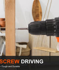 Close-up of a drill driving a screw into wood, showcasing use of the 104 Piece Drill Bit And Driver Set With Tough Case.