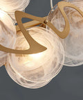 Close-up view of Top Tier Oval Glass Pendant Ceiling Lamp featuring postmodern design, showcasing globes and gold accents.
