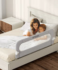 Foldable Toddler Bed Rail Guard With Bulletproof Anchor Strap And Zero Slide Base Design Heavy Duty Grey, protecting a bed with a mother and child.