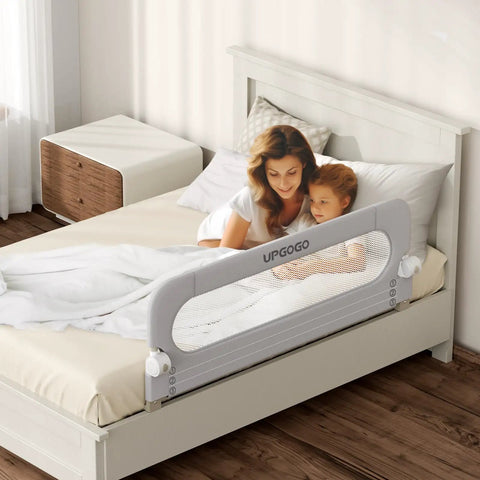 Foldable Toddler Bed Rail Guard With Bulletproof Anchor Strap And Zero Slide Base Design Heavy Duty Grey, protecting a bed with a mother and child.