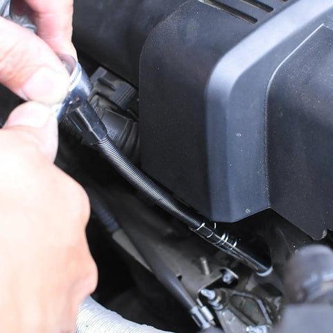 Flexible Socket Extension Bar Set With 1/4-Inch And 3/8-Inch Drives, tool in use on car engine, accessible tight space