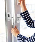 Child using 3 Pack Kid-Proof Safety Cabinet Locks for Home Use With Damage-Free Installation on a glass door, coded design visible.