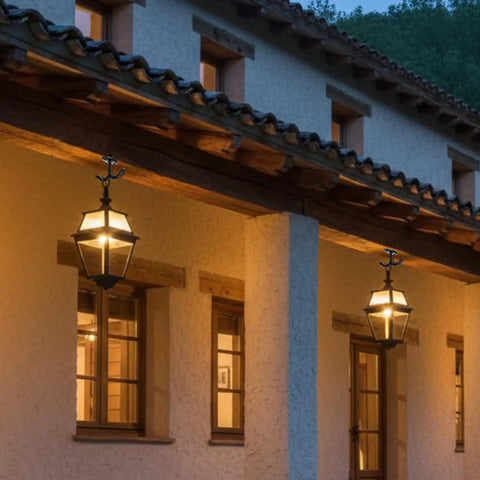 Outdoor lanterns hanging on rustic building facade with warm lights, showcasing evening ambiance and architectural design.