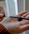 Magnetic Cable Zip Tie Mounts Black 20 Pack With 20 Black Zip Ties Included being held in hand
