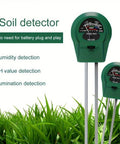 Three In One Soil Test Kit with Moisture Meter pH Meter and Fertility Tester on green grass background