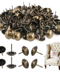 Premium Antique Bronze Upholstery Tacks 200 Piece Assortment Kit decorative thumb tacks on display with a cozy armchair background