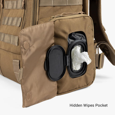 Close-up of hidden wipes pocket on MOLLE Compatible Diaper Backpack for Dads With Built-In Changing Mat And Stroller Straps
