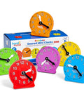 Six rainbow mini clocks in front of packaging, Awesome Set Of Six Rainbow Geared Mini Learning Clocks For Kids To Practice Telling Time Hands On These Analog Teaching Toys Feature Color Coded Movable Hands With Hidden Gears Keeping Hours And Minutes In Sync Perfect Math Manipulatives For Classroom