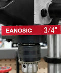 Close-up of a drill press chuck with a red label displaying 'EANOSIC 3/4'' in a workshop setting.