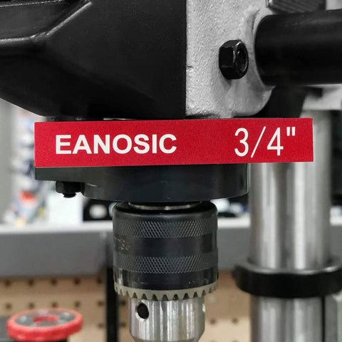 Close-up of a drill press chuck with a red label displaying 'EANOSIC 3/4'' in a workshop setting.
