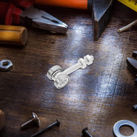 Detachable Double Bearing Groove Sliding Door Pulley 2.79 Inch Stainless Steel Track Roller on a wooden surface with tools