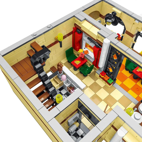 Interior close-up of the Lit 3-Floor Modular Pizza Shop Building Kit With Fully Printed Pieces, showing detailed dining area.