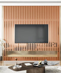 Ridiculously Sleek Rose Gold Metallic Peel And Stick Wall Panels Shimmer Stripe create a modern accent wall behind a TV.