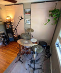 Ditch Junky Foam For This Top Shelf Sound Absorption Sheet Black Sound Dampening Blanket in music studio with drum set.