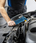Mechanic using Manual Grease Gun 80cc Mini Pro Grade Handheld Grease Applicator with Precision Nozzle on car engine