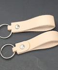 Premium Blank Natural Leather Keychains 10 Pack With Heavy Duty Metal Swivel Clasps showing leather strips with rings for customization.