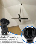 45 Degree Sloped Ceiling Fan Adapter Kit With Universal Mounting Bracket For Vaulted Ceilings Easy Install No Fuss Fit Handles 1 Inch Down Rods And 1.7 Inch Inner Brackets Black Pack Of 2 showing black adapter with fan on ceiling.