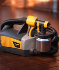 Control Spray Max HVLP Paint Sprayer For DIYers And Pros, corded turbine sprayer with hose and metal cup on wooden deck