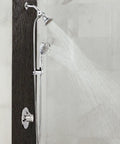 Four Function Eco Performance Handheld Shower With 69 Inch Hose And Wall Bracket, shown in a bathroom, water flowing