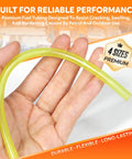 Hand holding yellow tubing from Dope Four Size Fuel Line Hose Kit For 2 Cycle Small Engines, 4 ft, flexible and durable