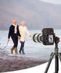 360 Degree Panoramic Ball Head With 1/4 Inch Quick Shoe Plate mounted on tripod in beach setting with couple and dog