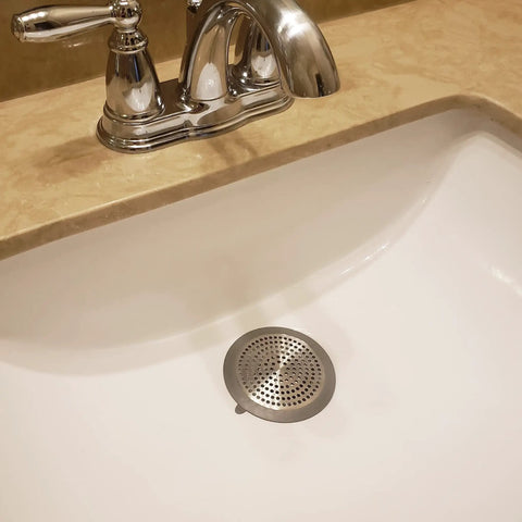 Bathroom Sink And Tub Hair Catcher 2 Pack Non Slip Drain Protector Anti Clog Filter in a white sink with chrome faucet.
