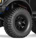 Stainless Steel M2.5 Long Wheel Nuts for TRX4M 1 18 Scale RC Crawlers Upgrade, installed on black wheel, close-up view