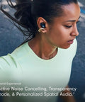 Woman running with Powerbeats Fit Wireless Earbuds With Secure Wing Tips For Gym Workouts, Bass Forward Noise Canceling Sound, in ear.