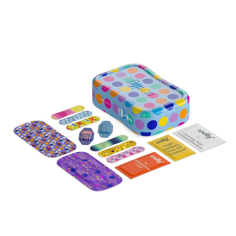 Welly first aid kit tin with colorful dots; includes 70-count adhesive bandages and ointment/cleansing wipe packets.